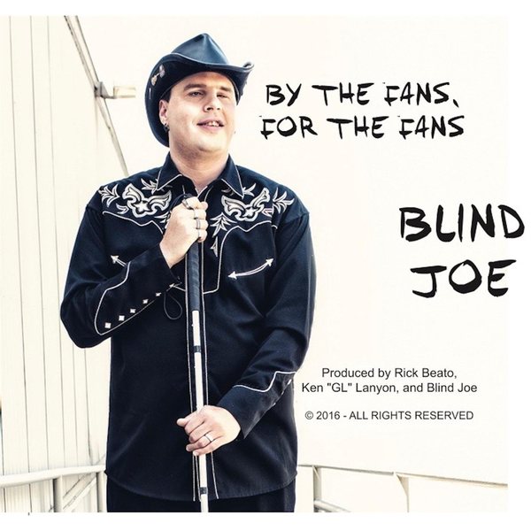 Album cover: Blind Joe smiling in a black cowboy hat and black embroidered western shirt, holding his white cane, with By the Fans, for the Fans and Blind Joe in black hand-drawn letters.
