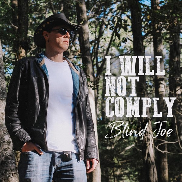 Album cover: Blind Joe in a black cowboy hat, sunglasses and leather jacket among tall trees, with I Will Not Comply in big rugged white letters and Blind Joe in white script.