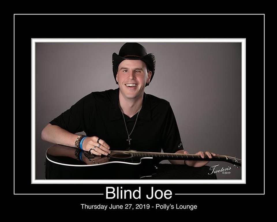 A show poster with a black-and-white style photo of Blind Joe smiling in a black cowboy hat, his flat-top acoustic guitar across his lap. Under the photo it says Blind Joe, Thursday June 27, 2019, Polly's Lounge.